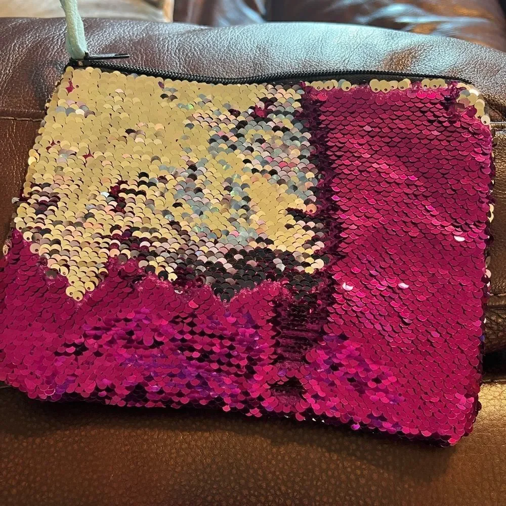 Claire’s color change sequin clutch or cosmetics bag